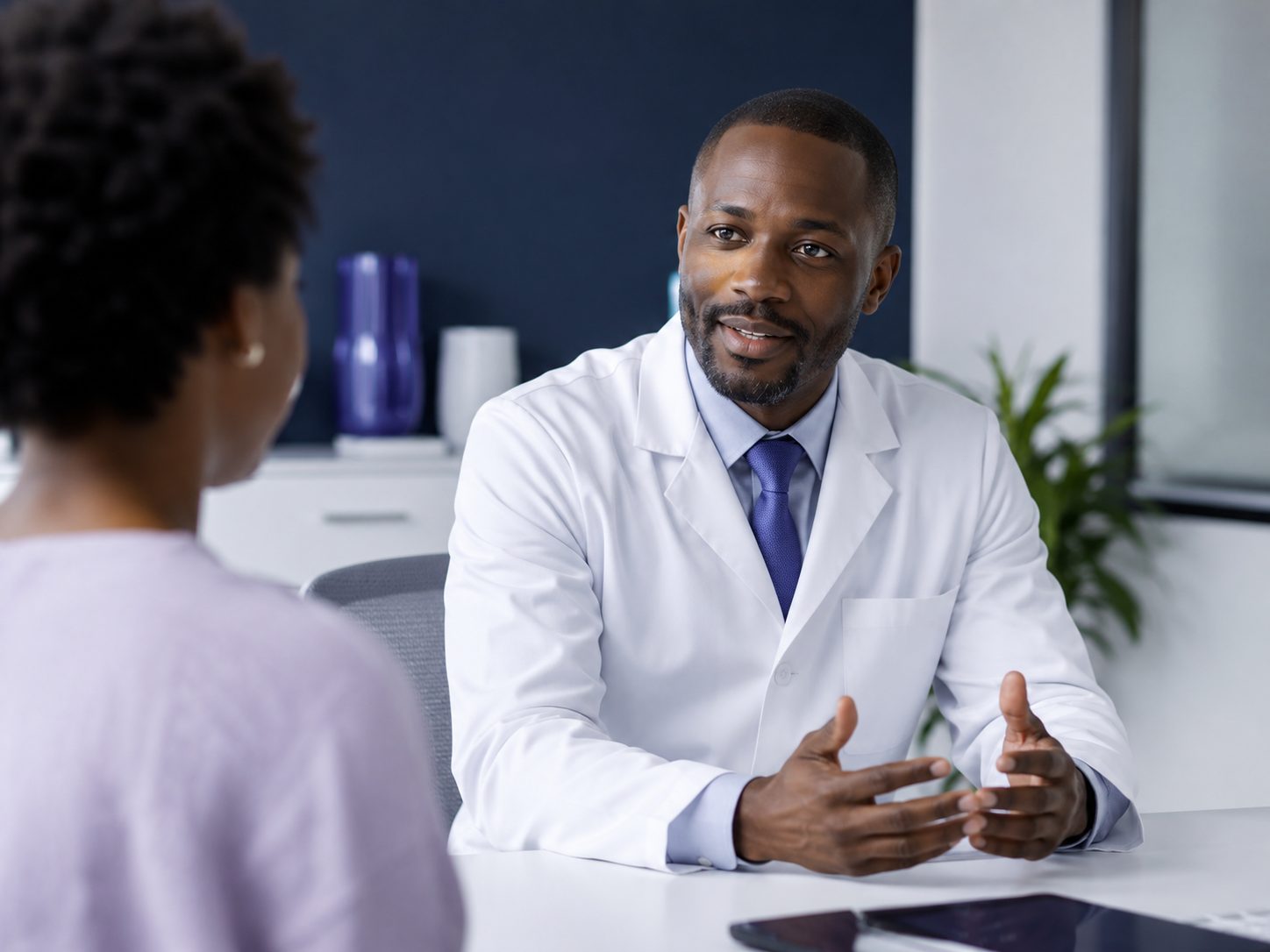 A clinician consulting with a patient - trust decided in the first minutes